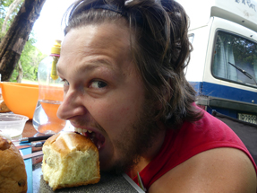 Thomas enjoys a hot cross bun - traditional food for easter Hot Cross Buns