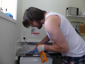 Thomas cleaning kitchen Cottage