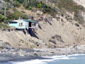 Zufahrt zum Cape Palliser mit Haus am Hang